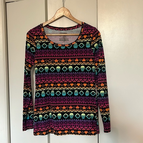 Long sleeve shirt. Black background with multicolor skull and heart detail. - Picture 1 of 4